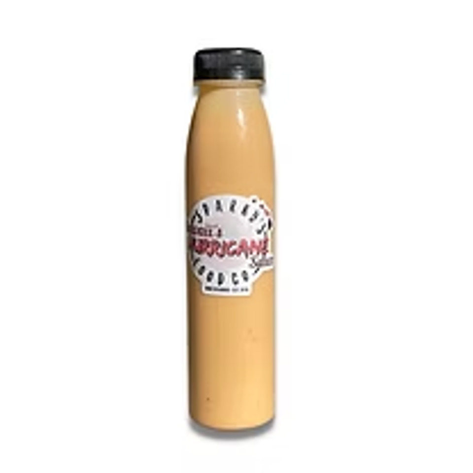 Tall tan beverage bottle with a black cap and illustrated white label.